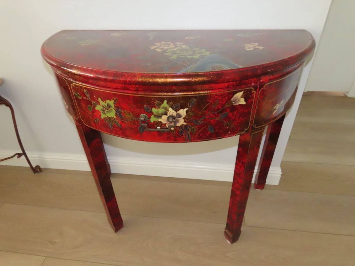 Demi lune Asian accents hall table with drawer.