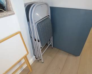 Folding games table and 4 chairs.