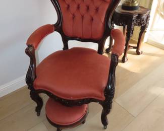 Antique deep tufted velvet chair with foot stool.