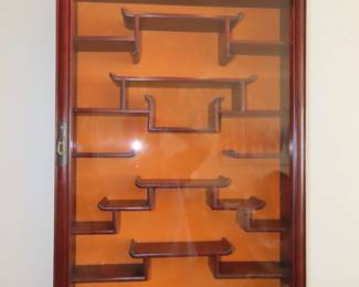 Rosewood wall curio.