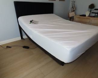 Like new adjustable queen size bed with beautiful blue headboard.