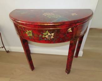 Demi lune Asian accents hall table with drawer.