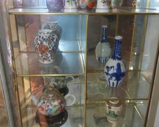 Two mirrored wall/hanging curio cases.