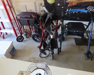 Wheelchair and three walkers.