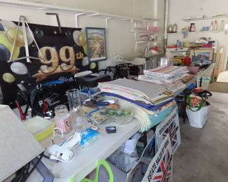 Garage area with tools, picnic supplies, medical equipment, fishing poles and more.