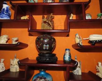Rosewood Asian wall curio with bone like pieces, Netsukes, miniatures.
