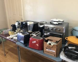 Miscellaneous kitchen equipment and dutch ovens.