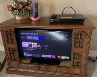 TV and cabinet sold seperately.