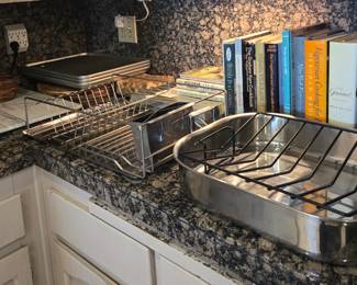 Kitchenware: large roasting pan, marble board, cook books, cookie/roasting pans