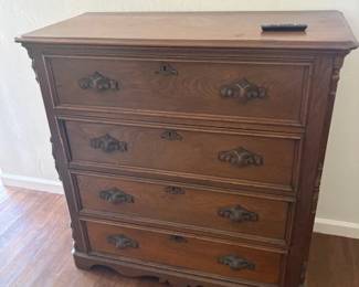 1920'S EASTLAKE WALNUT CHEST OF DRAWERSW CARVED PULL HANDLES. 41" H 19" D 44" W