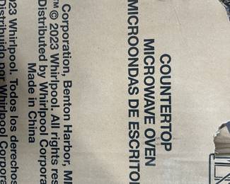 New - modern black microwave oven - $99