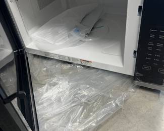 New - modern black microwave oven - $99