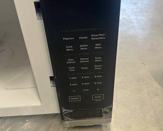 New - modern black microwave oven - $99