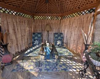 Iron lounge chairs in the gazebo 