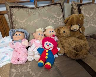 Vintage Cabbage Patch Kids dolls, clown, and teddy bears