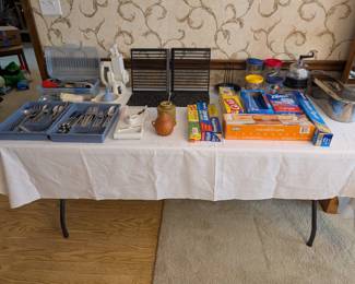 Flatware, cast-iron grates and griddle press. Terracotta garlic jar, ceramic glazed butter-bell. CuisinArt meat grinder with plug and attachments!