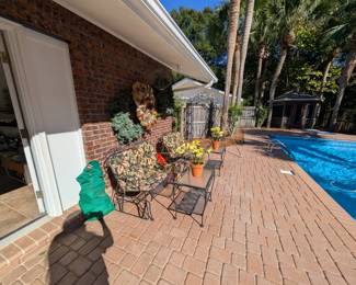 iron gliders and glass-top tables