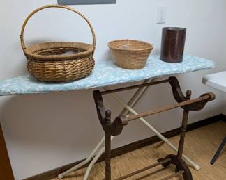 Ironing board, baskets, and blanket rack
