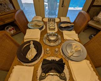 Tons of charger plates (silver, black, and white), loads of gorgeous vintage placemats and serving pieces