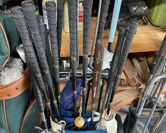 3 sets of vintage golf clubs - smallest and oldest caddy carts I've seen. 
