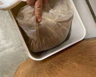 buckets and containers full of bonsai media. 