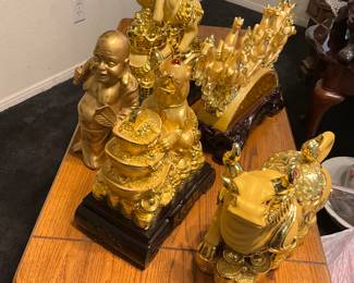 Miscellaneous figurines, A golden rat statue symbolizing wealth and prosperity on an inscribed base. A modern Feng Shui decorative statue of a bull with gold accents. A modern decorative resin horse statue with gold electroplating. I estimate this decorative resin horse statue to be valued between $50-$100 USD. Sale price, $30 each.