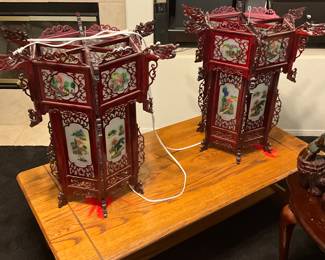 Antique Chinese carved rosewood dragon lanterns with reverse glass painted panels. estimate these Chinese rosewood lanterns to be valued between $400-$600 USD. Sale for both $300
