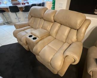 Three sets of these, beige leather reclining loveseat with cup holders by Ashley Furniture. estimate this Ashley Furniture Darshmore reclining loveseat to be valued between $200-$400 USD. Sale price $25 each