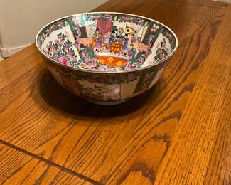 Vintage Famille Rose porcelain punch bowl with figural and floral decoration. estimate this Famille Rose porcelain bowl to be valued between $150-$250 USD. Sale price $50