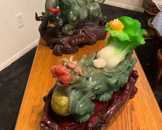 A modern green resin bull sculpture with Chinese characters for wealth. estimate this decorative bull sculpture to be valued between $50-$150 USD. Modern resin Feng Shui Pixiu and cabbage sculpture with auspicious symbolism. estimate this decorative Pixiu and cabbage sculpture to be valued between $30-$70 USD. Sale price for both, $80