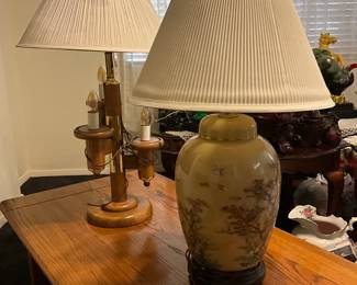 A Chinoiserie hand-painted ceramic ginger jar table lamp. estimate this decorative Chinoiserie ginger jar lamp to be valued between $150-$300 USD. A mid-century tiered wooden table lamp with candle-style bulbs. estimate this mid-century wooden table lamp to be valued between $150-$300 USD. Sale price for both $100