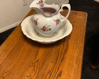 Victorian-era ceramic washbasin and pitcher set with floral decoration. estimate this washbasin and pitcher set to be valued between $50-$150 USD. Sale price $25