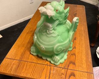 A green jade-colored Foo dog or Pixiu decorative figurine. estimate this decorative Foo dog figurine to be valued between $100-$250 USD. Sale price $50