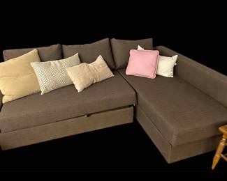 Sofa sectional that converts to a bed complete with underneath storage