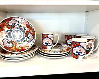 Imari pattern plates and cups