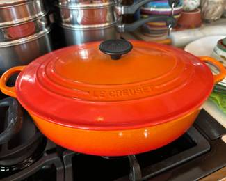Le Creuset orange dutch ovens....