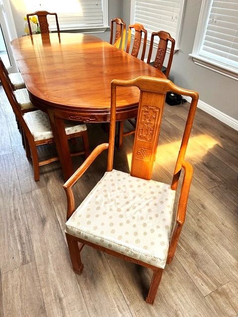 Available for Pre-Sale. Gorgeous Vintage Hand Carved Chinese Rosewood Oval Dining Set in very good condition. Table with 2 removable leaves for your convenience. The set comes with 6 side chairs and 2 armchairs. Silk has always been covered in plastic. This set can mix well with eclectic, modern or traditional design. $1900. Or Best Offer. Call Connie for more info. 619-962-1800