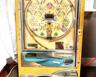 Nishijin Pachinko Pinball machine. Needs some electric work but physically in good condition. Includes tub of steel balls.