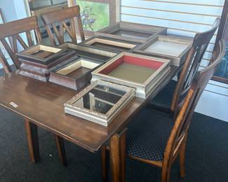 Frames. Table with four chairs