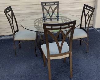 Wrought iron dining set with round glass top table. Ready to use. Lightweight, easy to move