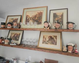 A collection of Royal Dalton Toby jugs priced individually, and five signed lithographs of the same artist $250 for all of the lithographs.