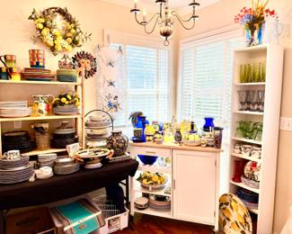 KITCHEN WITH EVERYDAY DISHES AND GLASSWARE.