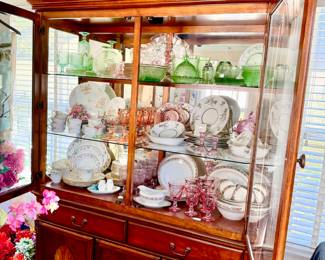 LARGE CHINA CABINET WITH DEPRESSION GLASS AND MULTIPLE SETS OF CHINA.