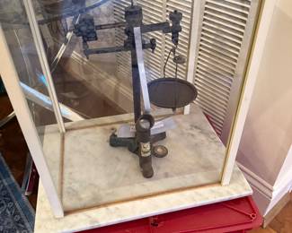 Rare set of antique scales in custom made container.
