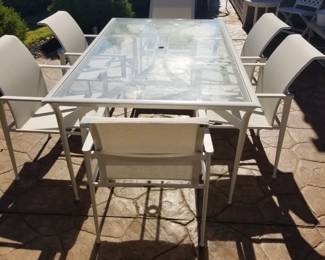 Brown  Jordan patio table and six chairs. 