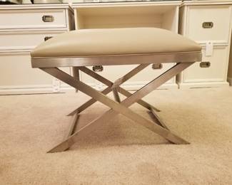 Classic leather ottoman with metal frame from Ethan Allen. 