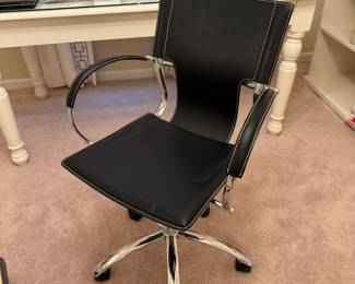 Modern chrome and black leather office chair. 