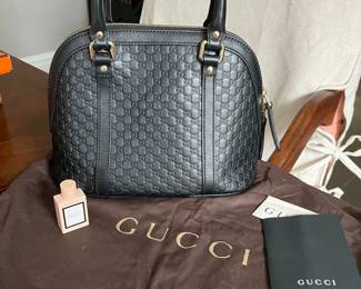 Never used Gucci black handbag with original receipt and dustbag