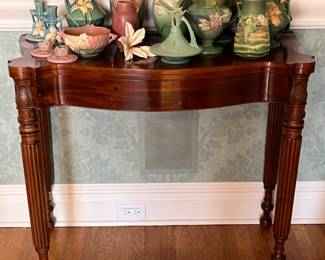 a beautiful reeded leg flip top table with a large collection of Roseville pottery - 34w x 17d x 30h
