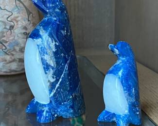 carved stone penguins